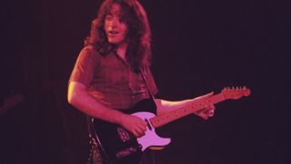 Rory Gallagher performs at the Omni Coliseum on February 8, 1976 in Atlanta, Georgia