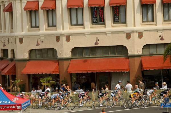 The women's field rides through downtown