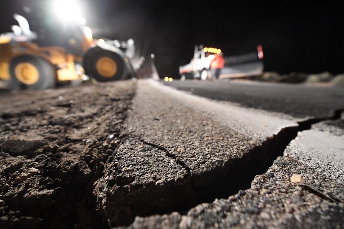 Highway workers repair a hole that opened up after a 7.1-magnitude earthquake rocked an area near Ridgecrest, California on July 5, 2019.