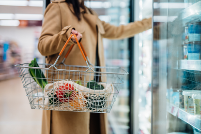 Woman buying food from the supermarket after checking whether shops are open on Easter Sunday