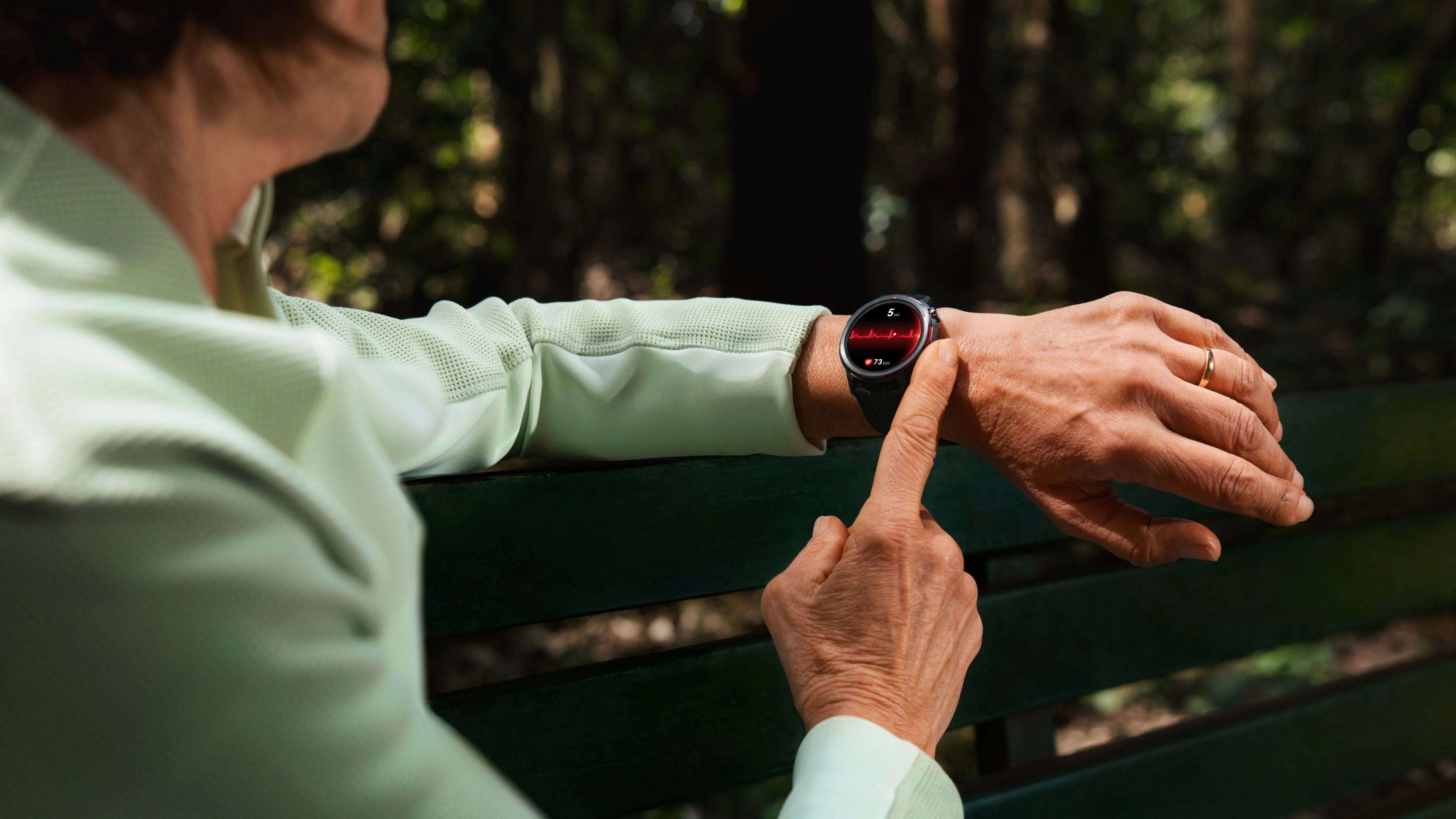 Huawei Watch GT Runner 2 on the wrist of a middle-aged woman