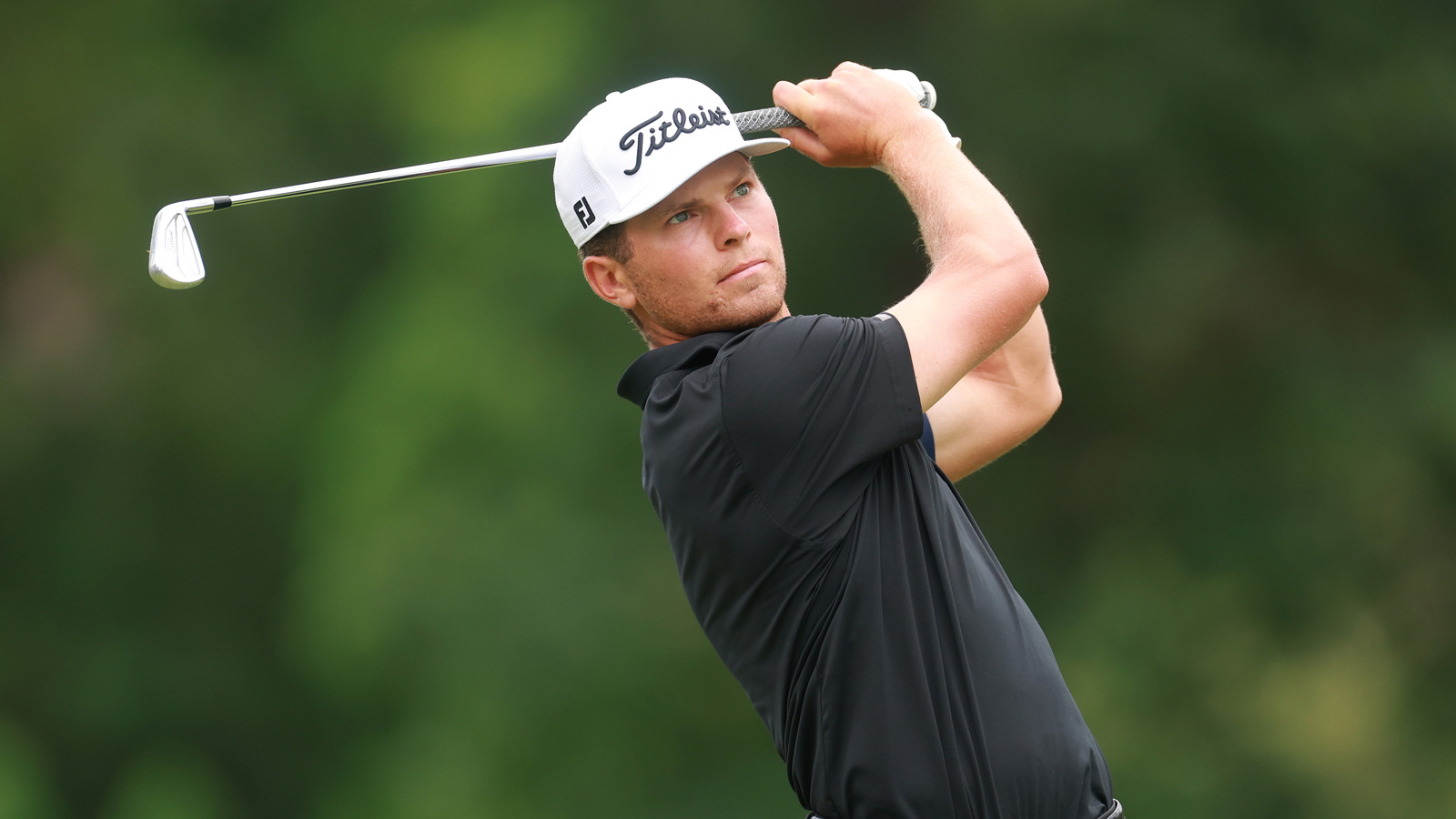 Michael Brennan hits a wedge shot