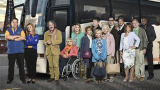 Murder on the Blackpool Express cast stood next to a coach
