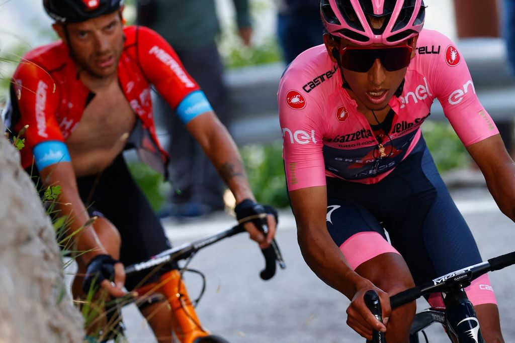 Overall leader Team Ineos rider Colombias Egan Bernal R rides in the final ascent during the 17th stage of the Giro dItalia 2021 cycling race 193km between Canazei and Sega di Ala on May 26 2021 Photo by Luca Bettini AFP Photo by LUCA BETTINIAFP via Getty Images