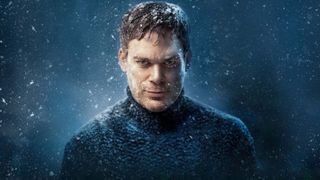 Dexter wears a navy knitted turtleneck jumper, starting straight down the lens covered in snow
