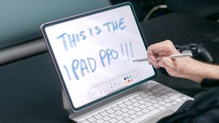 The new Apple Pencil Pro being used with an iPad Pro.