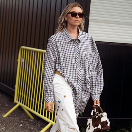 copenhagen showgoer wearing plaid shirt and white pants