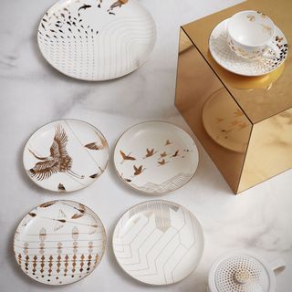 white designed plates and cup