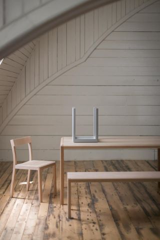 Furniture by Anthony Guex for Fogo Island Inn including wooden armchair, table and bench