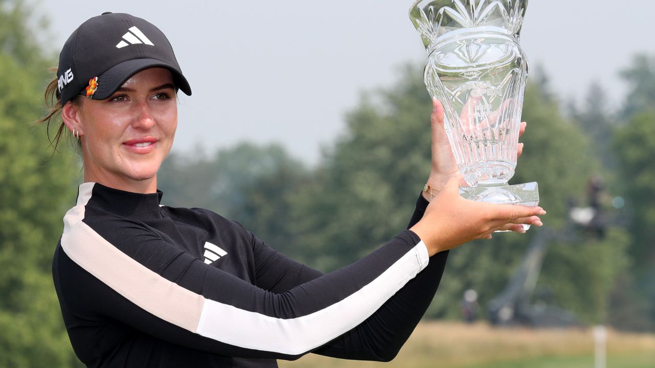 Linn Grant lifting a trophy after securing victory at the Dana Open