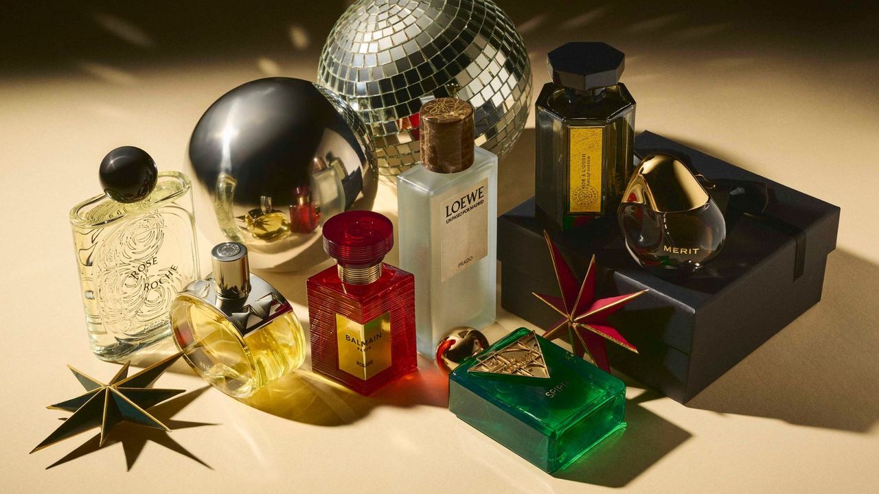 The best fragrance Christmas gifts including Merit Retrospect, Loewe Prado, Balmain Rouge and Hermes Barenia, shot with disco balls