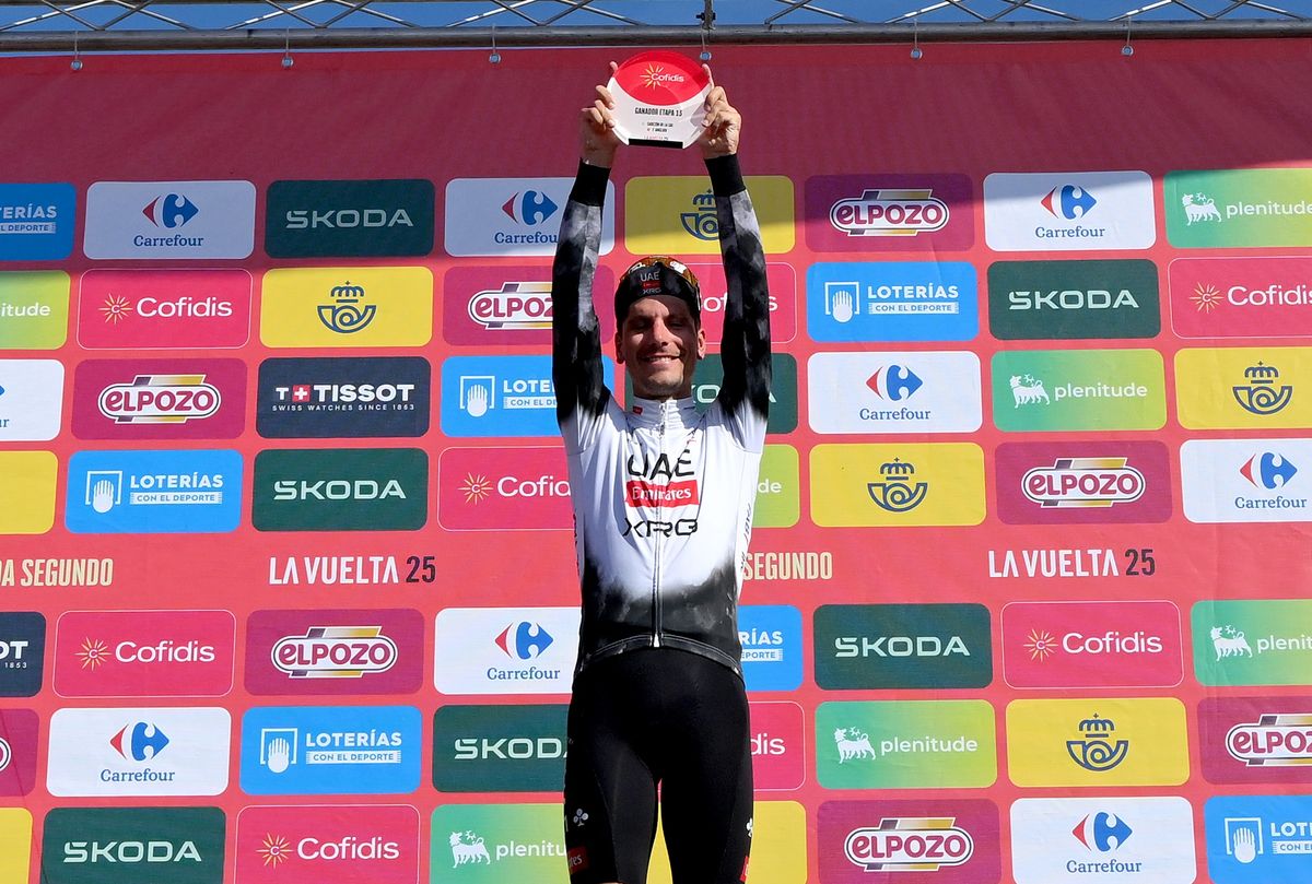 L'ANGLIRU, SPAIN - SEPTEMBER 05: Joao Almeida of Portugal and UAE Team Emirates - XRG celebrates at podium as stage winner during the La Vuelta - 80th Tour of Spain 2025, Stage 13 a 203.7km stage from Cabezon de la Sal to L'Angliru 1556m / #UCIWT / on September 05, 2025 in L'Angliru, Spain. (Photo by Tim de Waele/Getty Images)