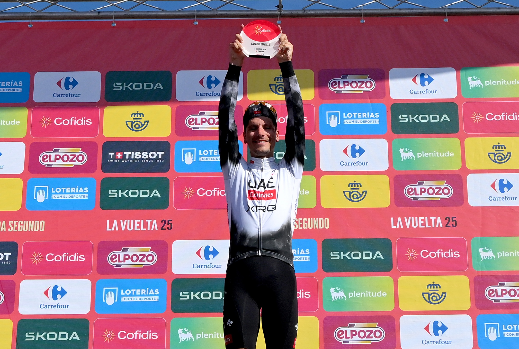 L'ANGLIRU, SPAIN - SEPTEMBER 05: Joao Almeida of Portugal and UAE Team Emirates - XRG celebrates at podium as stage winner during the La Vuelta - 80th Tour of Spain 2025, Stage 13 a 203.7km stage from Cabezon de la Sal to L'Angliru 1556m / #UCIWT / on September 05, 2025 in L'Angliru, Spain. (Photo by Tim de Waele/Getty Images)