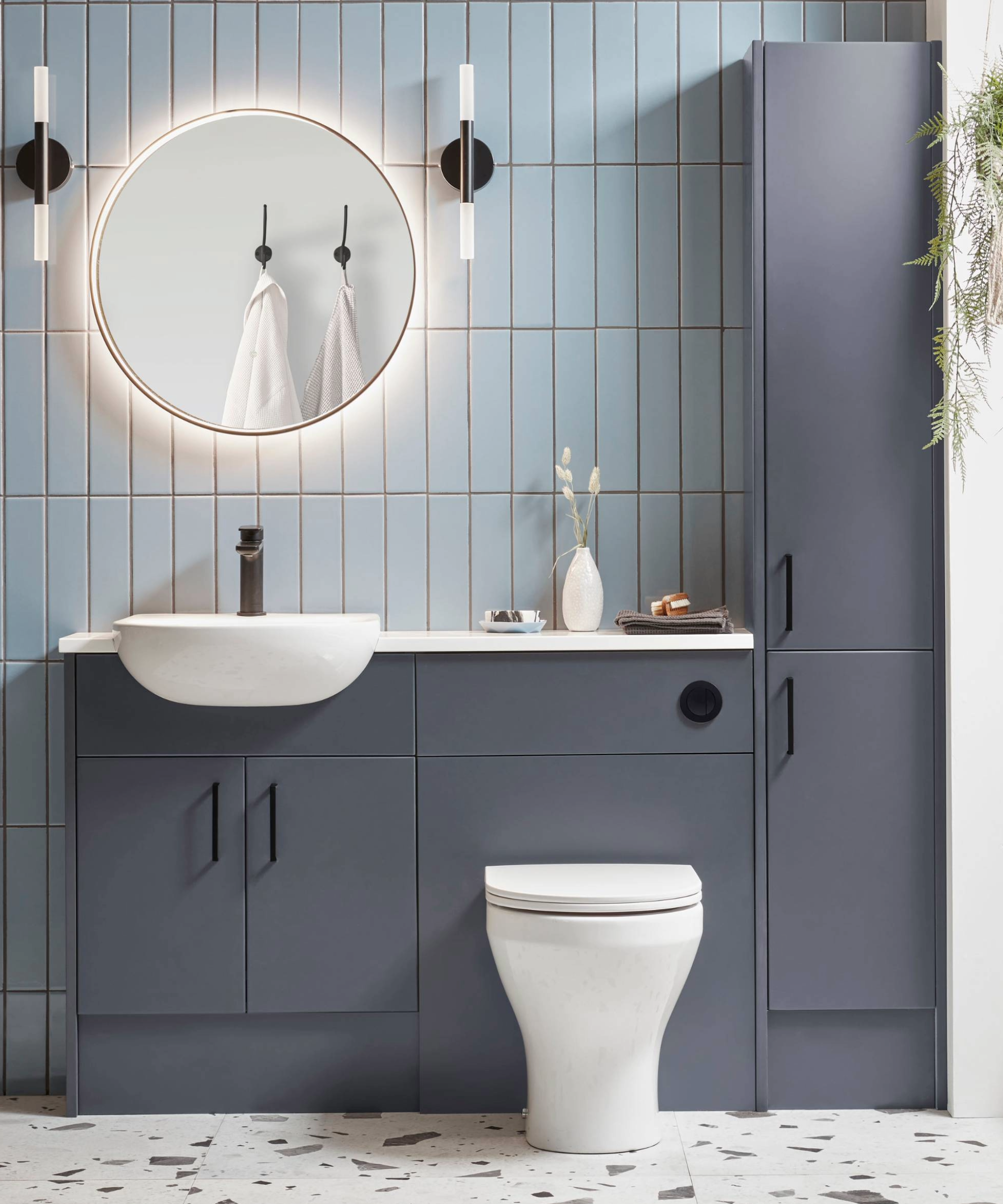 Bathroom with built-in storage unit under basin and toilet