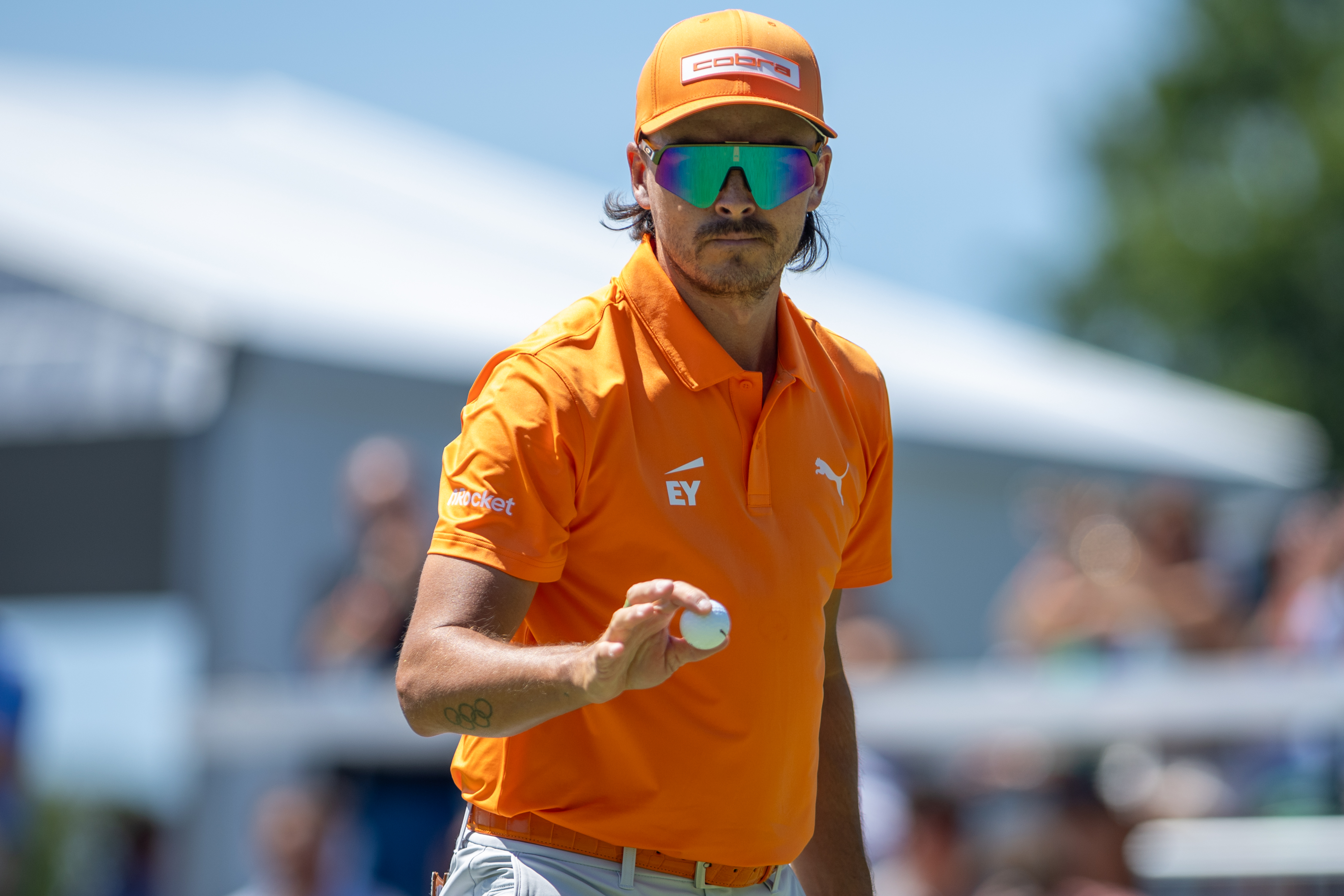 Rickie Fowler motions to the crowd after putting on the ninth hole during the final round of the Truist Championship