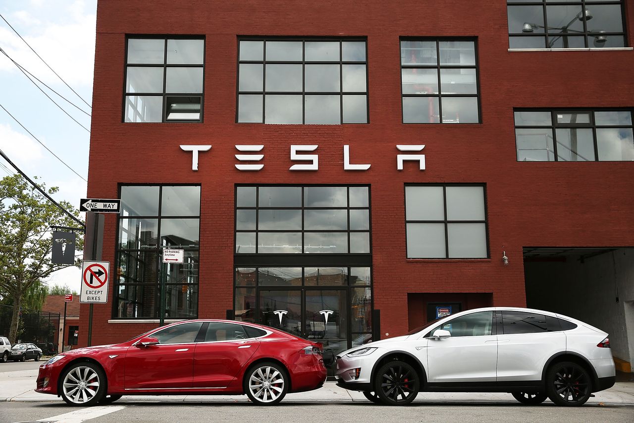 Tesla cars outside a showroom