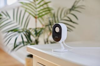 Arlo Essential Indoor Camera in white on a table