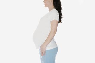Pregnant woman in profile