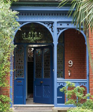 traditional front porch painted in dark blue exterior eggshell paint