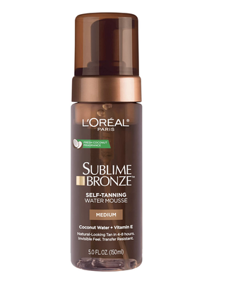 A bottle of Loreal Sublime Bronze self-tanning water mousse against a white background.