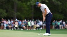 Justin Thomas of the United States putts on the first green during the first round of the 2024 Masters