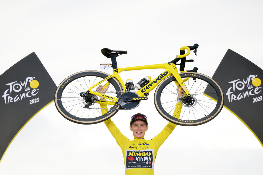 PARIS, FRANCE - JULY 23: Jonas Vingegaard of Denmark and Team Jumbo-Visma - Yellow Leader Jersey celebrates at podium as final overall winner with a custom yellow Cerv&amp;eacute;lo bike during the stage twenty-one of the 110th Tour de France 2023 a 11 5.1km stage from Saint-Quentin-en-Yvelines to Paris / #UCIWT / on July 23, 2023 in Paris, France. (Photo by David Ramos/Getty Images)