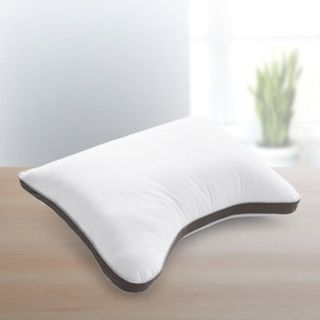 PlushComfort Curved Pillow on a counter.