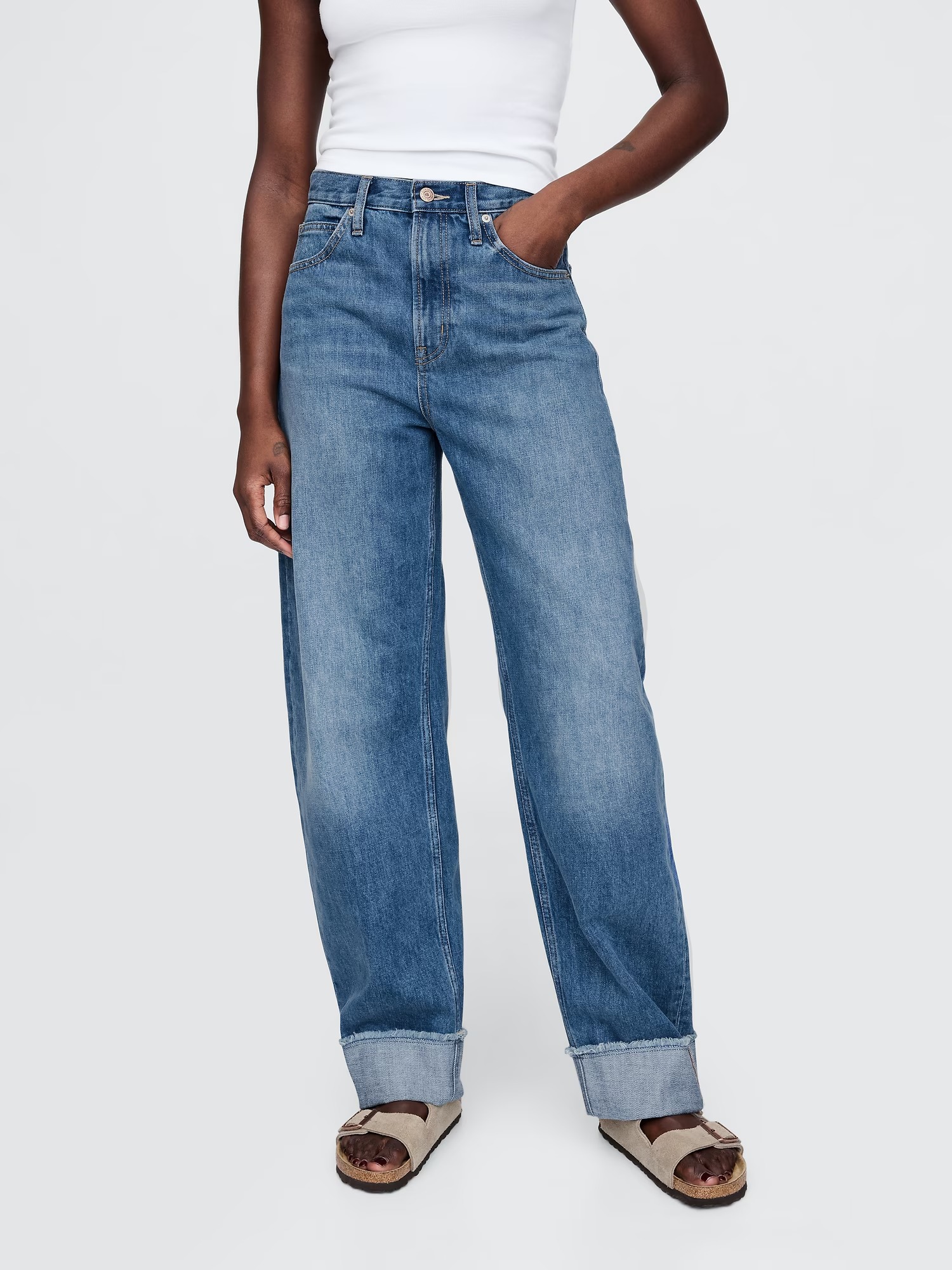 Woman wearing blue high rise cuffed jeans