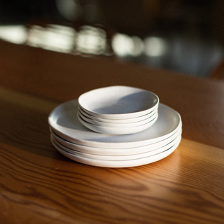 mini ceramic plates on top of larger ceramic plates