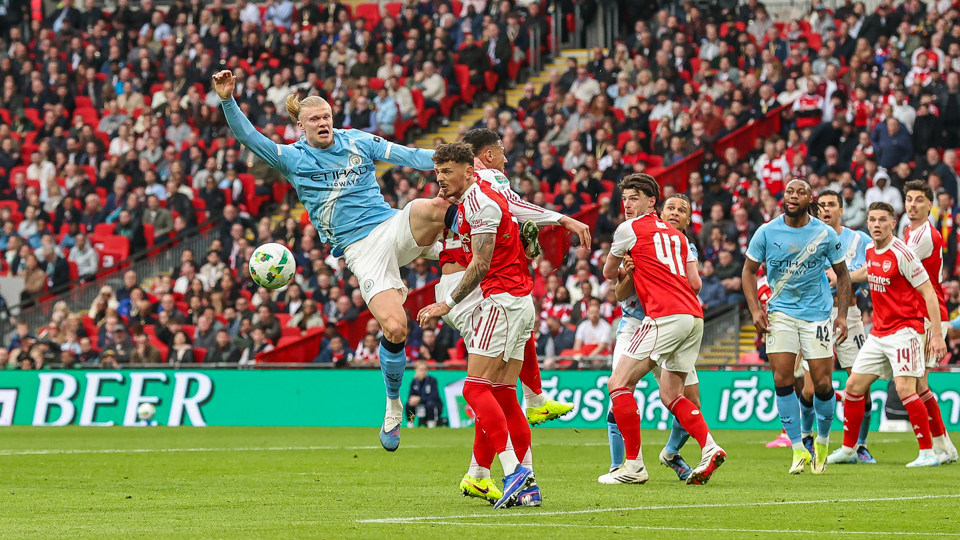 Erling Haaland of Manchester City jumps to head the ball towards goal during the Carabao Cup Final match between Arsenal and Manchester City