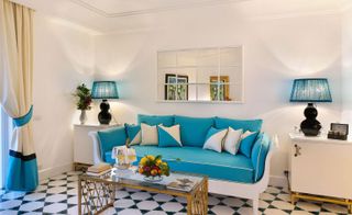 Blue and white themed living space of hotel room