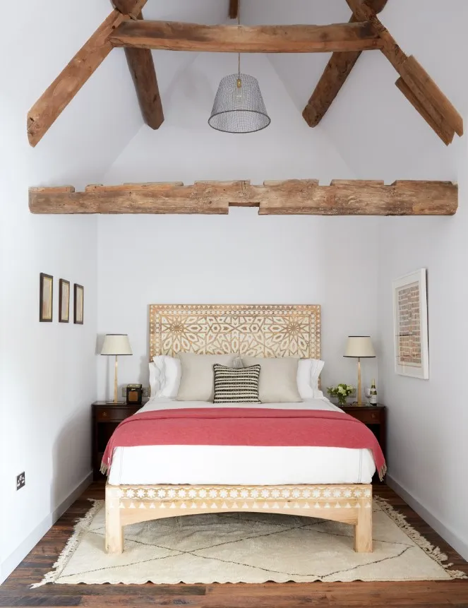 Havwoods bedroom with white walls and wood beams