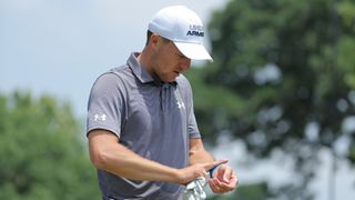 Jordan Spieth checks his injured wrist at the Charles Schwab Challenge