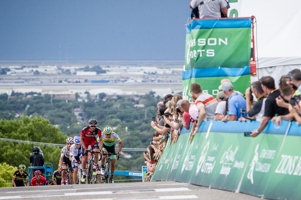 Riders cross over the top of the climb
