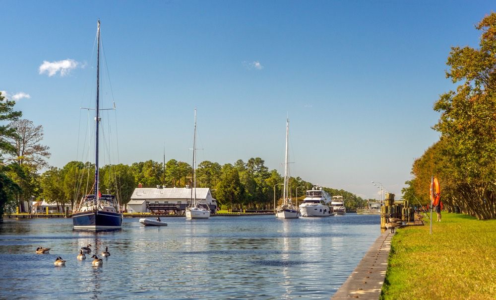 Boats exiting the Great Bridge Locks. Located in Chesapeake Virginia on the Inter-coastal Waterway heading south to North Carolina.