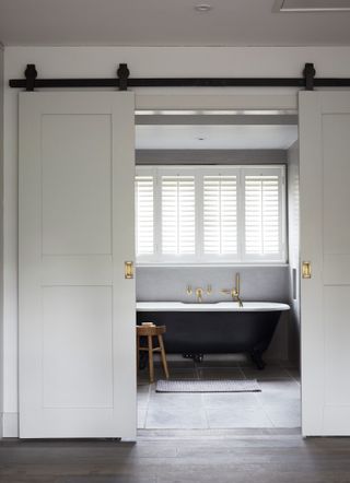 grey bathroom with sliding barn doors