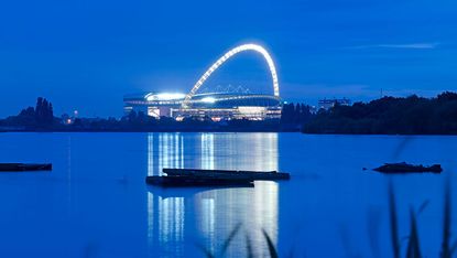 example of stadium architecture, foster and partners' wembley stadium, at night