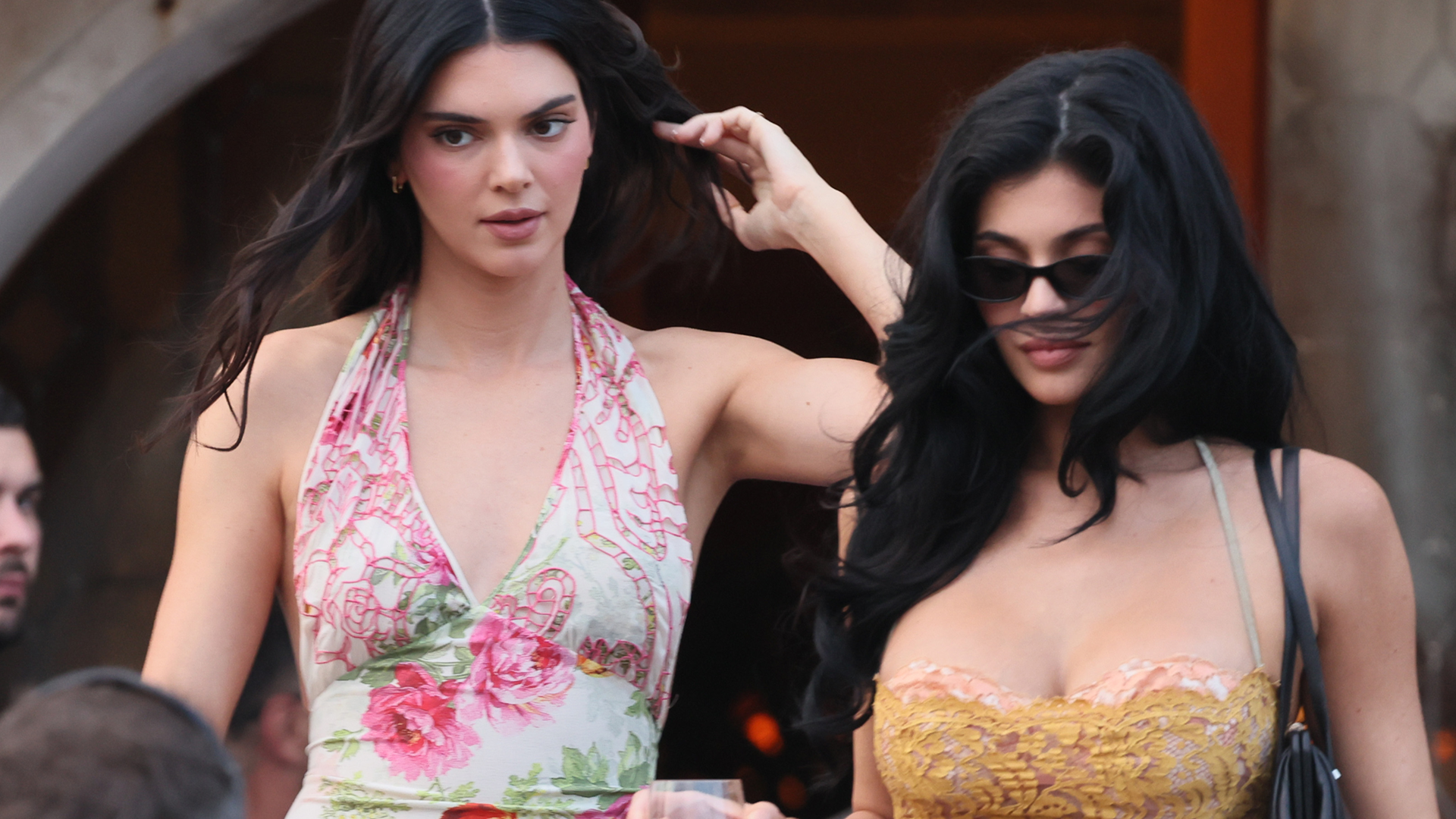 Kendall Jenner and Kylie Jenner arrive in summery styles at the Besos wedding in Venice