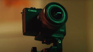 The Canon EOS M200 camera mounted on a tripod
