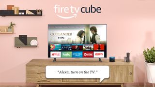 An Amazon Fire TV Cube press image, the Fire TV Cube pictured near a TV display