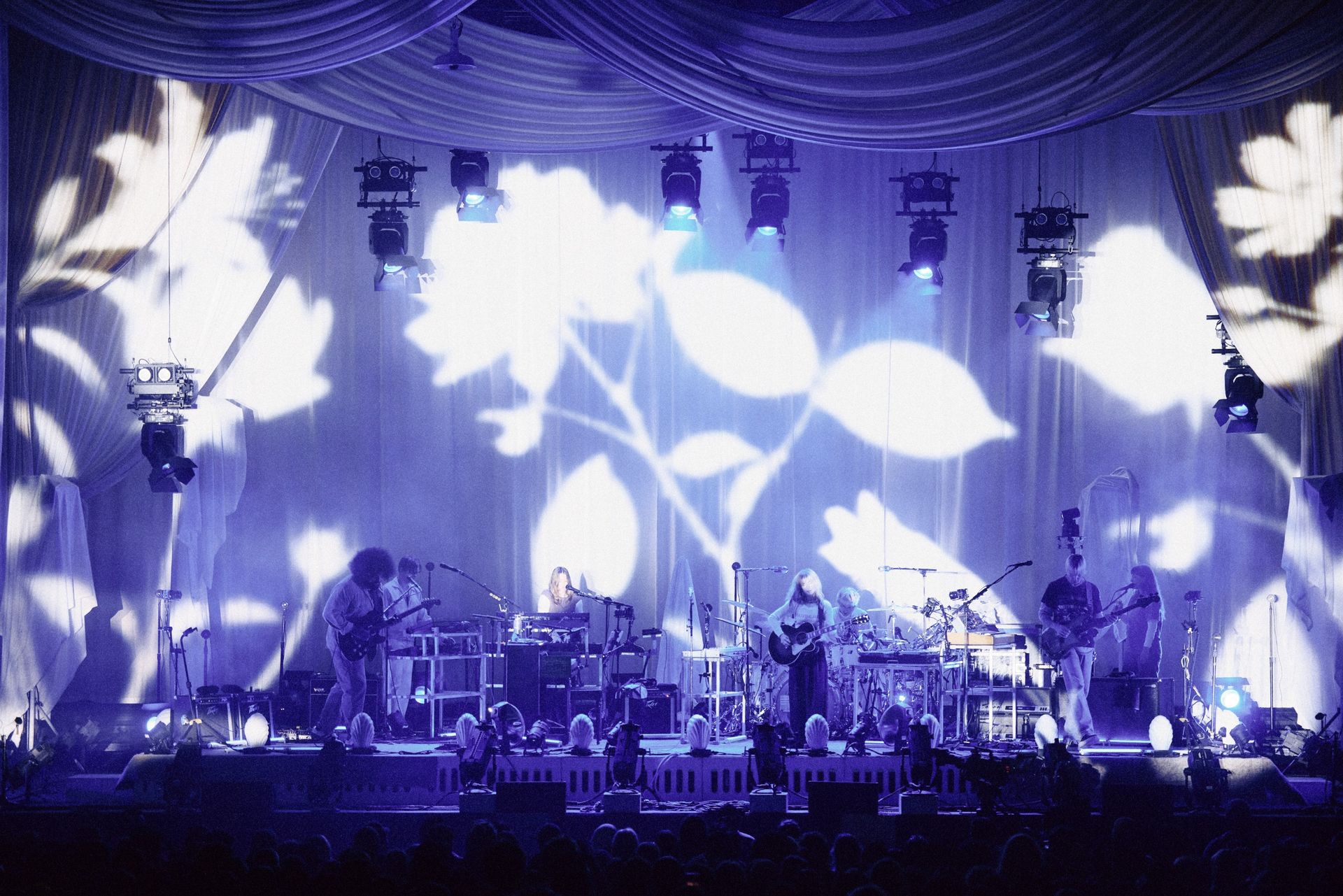 bands on stage in pink light