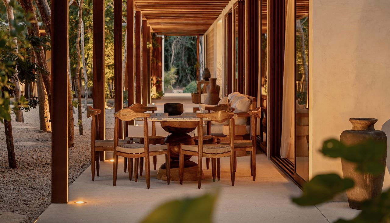 An outdoor dining room with mood lighting