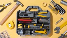 Photo of various tools around a tool container