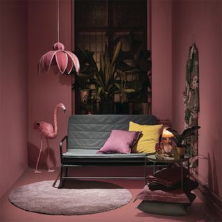 Ikea hammarn sofa bed in pink painted room with flamingo ornament
