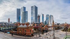 A multi image panorama of Deansgate in Manchester taken in February 2023 backed by the Deansgate Square skyscraper complex.