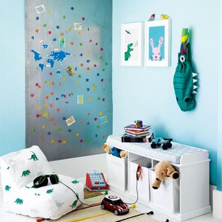 blue kids room with floor cushion and metal magnet wall feature