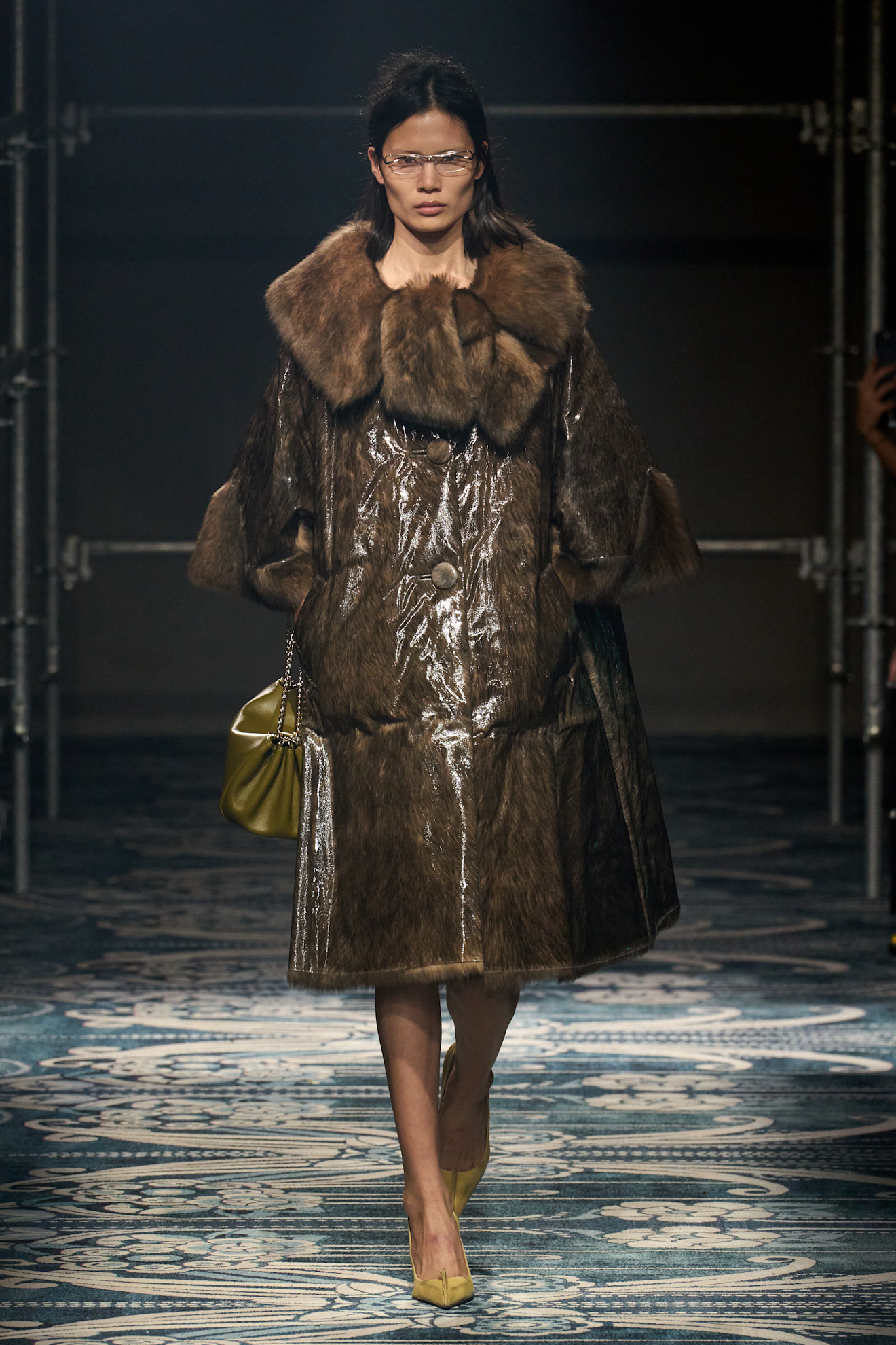 Prada runway model with olive green purse