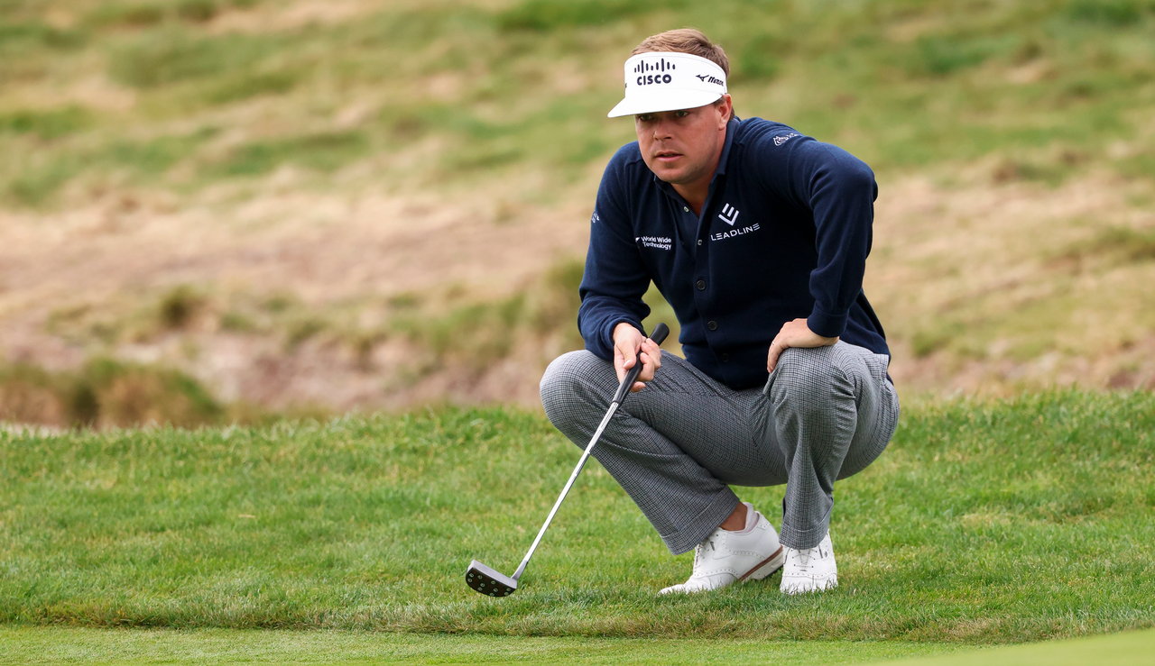 Keith Mitchell lines up a putt