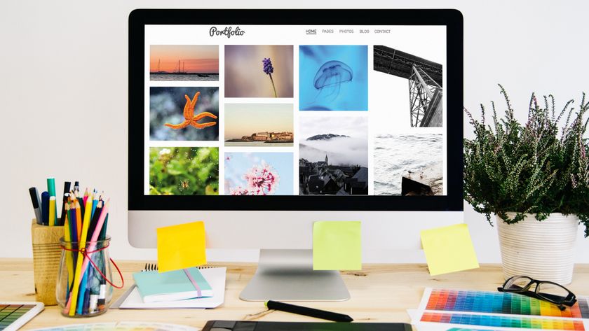 A desktop with a colourful portfolio on screen