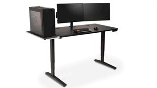 Uplift V2 standing desk review: An image showing the desk in all black, with two black monitors sat on top of it